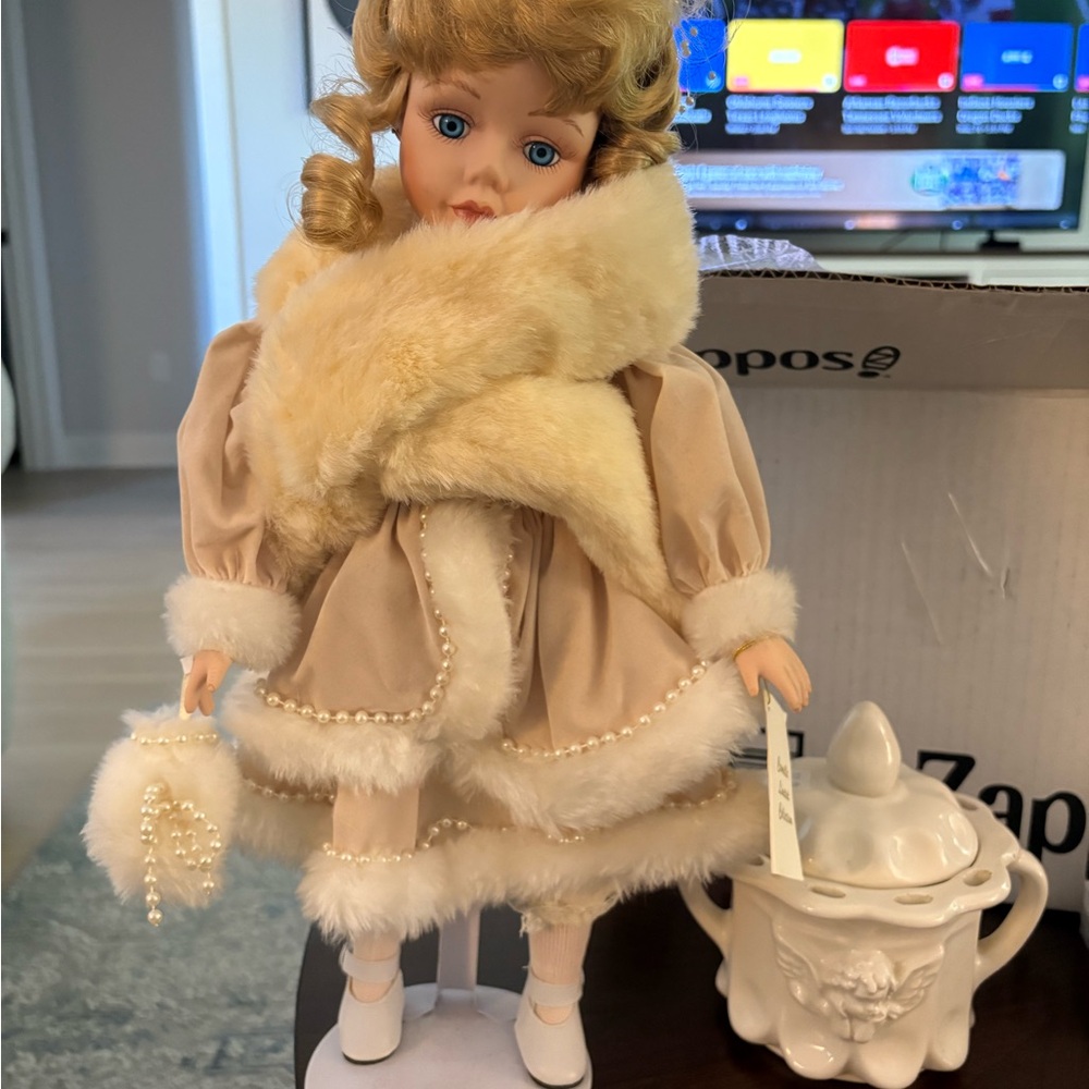 Elegant Doll with Fur Trim and Pearl Accents